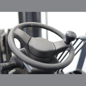 EK20D steering wheel with a single-hand spinner knob for one-handed maneuvering.