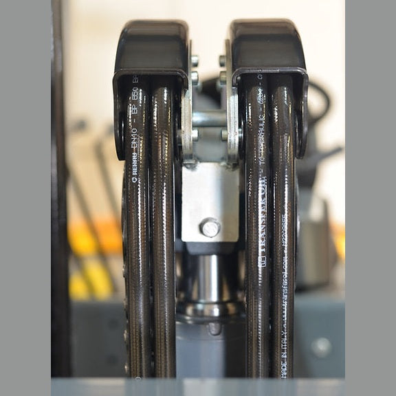 Top-of-mast detail on EKKO EK50LP showing twin mast pulleys and routed hydraulic hoses