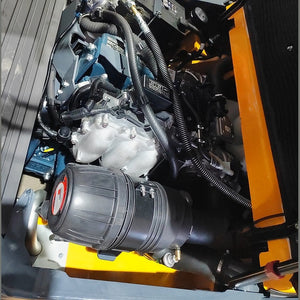 Kubota engine bay on EKKO EK50LP with cylindrical air-filter housing and intake manifold visible