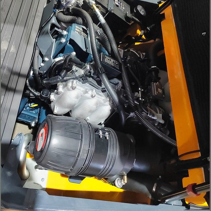 Kubota engine bay on EKKO EK50LP with cylindrical air-filter housing and intake manifold visible