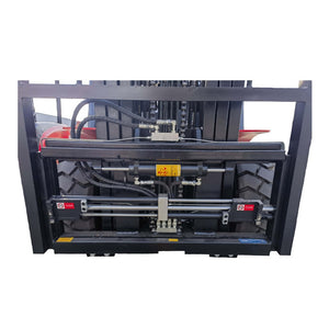 A heavy-duty industrial fork lift attachment or loader system with hydraulic cylinders, hoses, and metal frame components, shown against a plain white background.