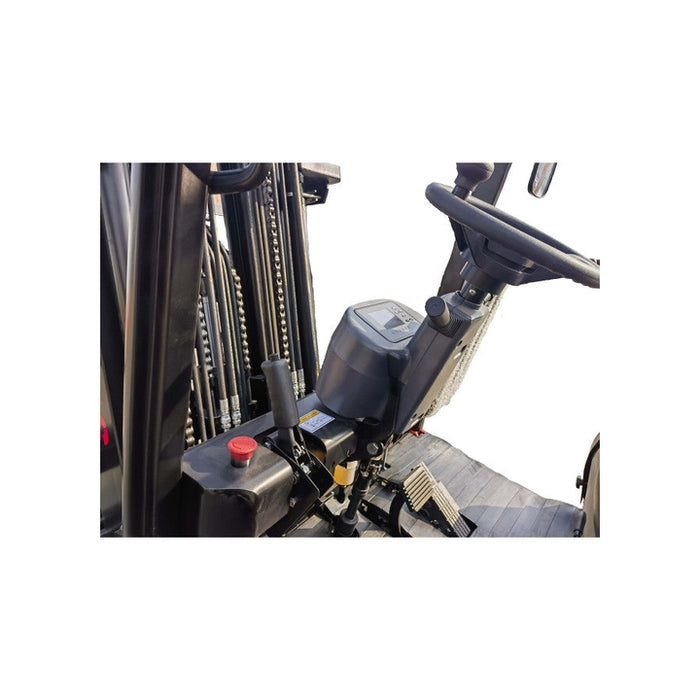 Close-up of the operator seat and control console of a black forklift, showing the steering wheel, foot pedals, and control levers against a white background.